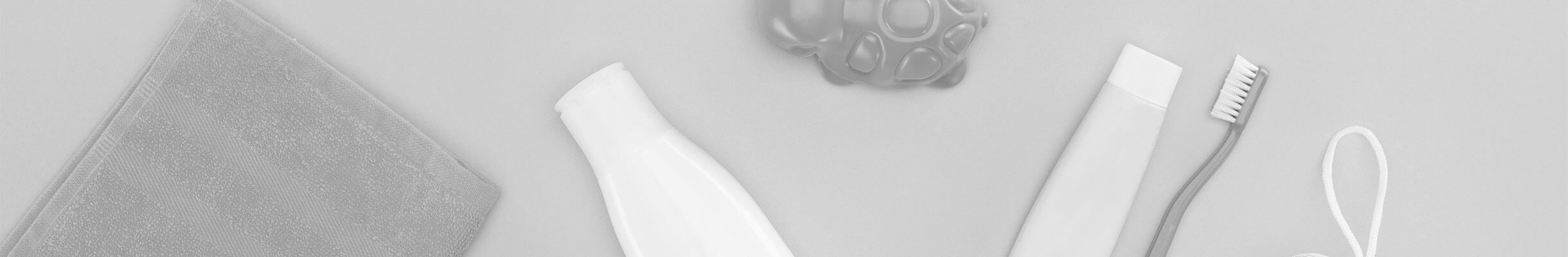 The image shows a blurry interior space with indistinct objects, including what appears to be a table and possibly some books or papers, suggesting a study or office environment.