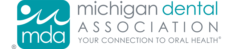 The image shows a logo with text that reads MICHIGAN DENTAL ASSOCIATION at the top, followed by additional text stating YOUR CONNECTION TO ORAL HEALTH, and below that, there s a graphic of a stylized fish and a person s head with a toothbrush. The logo is set against a light background with a blue border framing it.