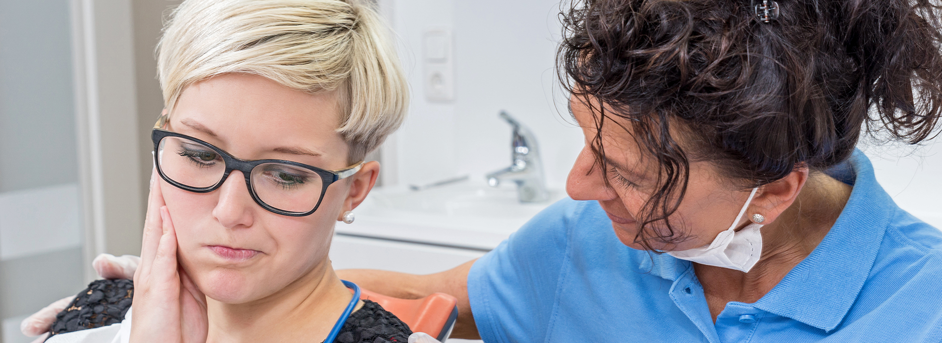 A split-screen photo showing two different scenes  on the left, a woman with glasses sitting in front of a dental chair  on the right, a dentist performing a procedure on her teeth while she looks on.